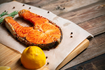 Grilled salmon on wooden table