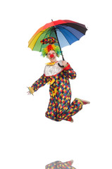 Clown with umbrella isolated on white