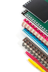 Stack of notebooks on white background with copy space
