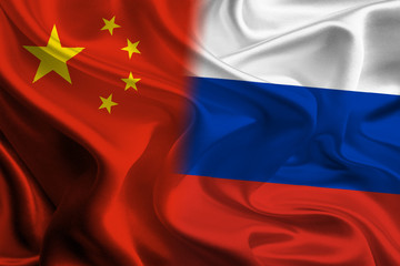 Chinese and Russian Flags waving together concept