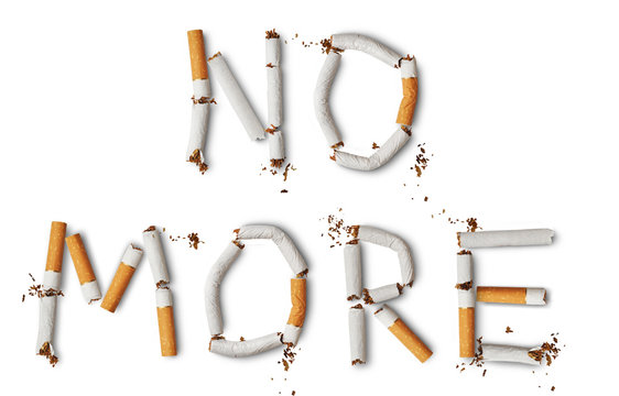 Text ''NO MORE'' made from broken cigarettes
