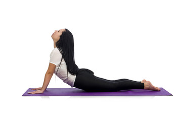 Woman doing exercises on white