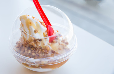  ice cream with a plastic disposable