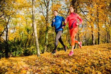 Deurstickers Friends jogging in autumn nature © Martinan