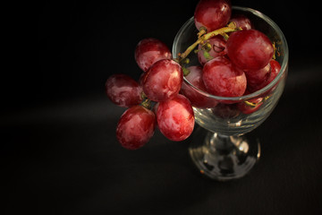 Fresh grapes on wine glass