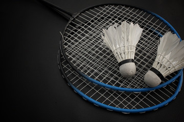 Shuttlecocks with badminton racket