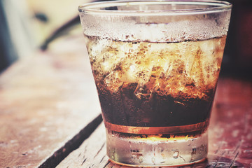 Cola with ice cubes