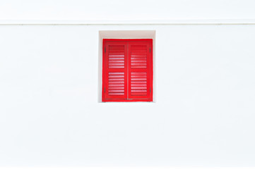 Red window on the white wall