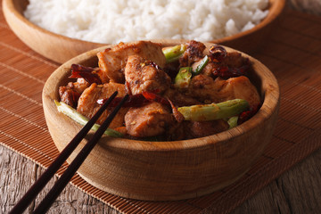 traditional kung pao chicken in a bowl close-up. horizontal
