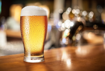 Beer glass on the bar counter.