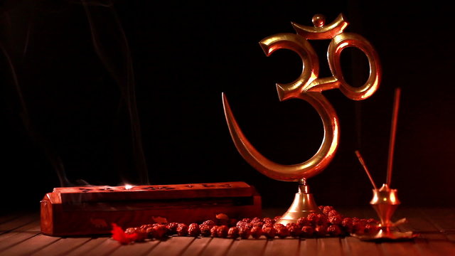 Om symbol and incense stick