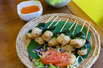 grilled pork wrapping with Wildbetal leafbush