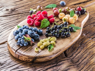 Ripe berries on the old wooden plank.