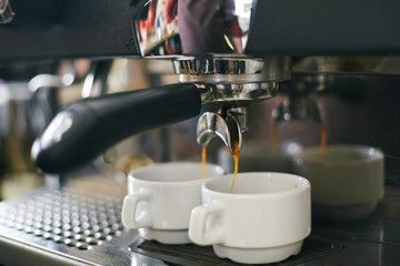 Fototapeta na wymiar Coffee pouring into cups