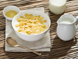 Cornflakes cereal and milk.