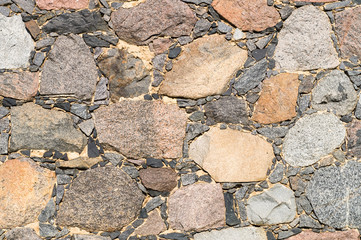 Stone wall, motley boulders background
