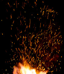 Fototapeta na wymiar smithy fire flame tips with sparks closeup
