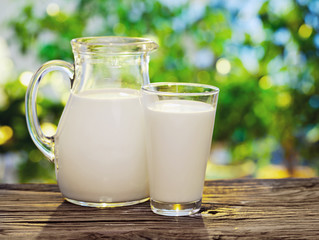 Milk in jar and glass.