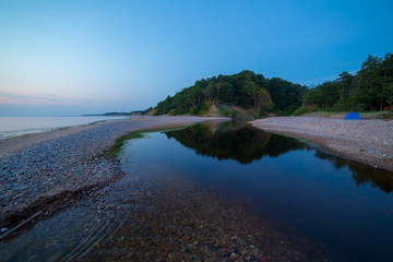 Tent near tranquil water