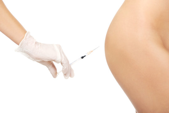 Injection before surgery on a woman's bottom
