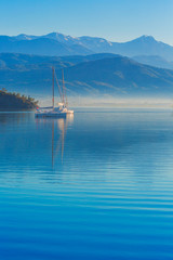 Anchored yachts at misty morning