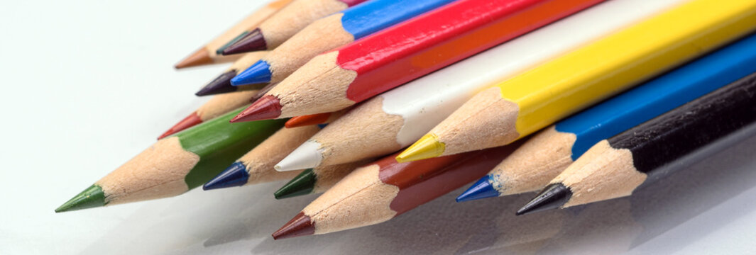 The colored pencils on a white background
