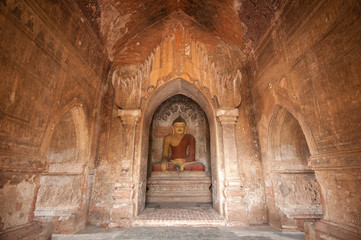 BAGAN, MYANMAR - MAY 4: Buddha statue inside ancient pagoda on MAY 4,2013 in Bagan, Myanmar. Bagan's prosperous economy built over 10000 temples between the 11th and 13th centuries.