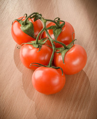 Fresh tomatoes on a cutting board
