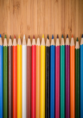 colored pencils colored pencils on the wooden table clous-up