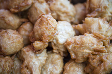 Thai street food close-up of fried fish balls at a stall in Bangkok, Thailand
