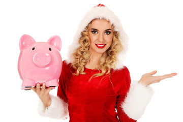 Santa woman holding a piggy bank