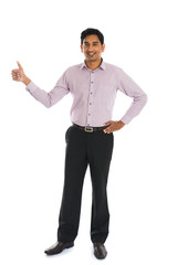 indian business male with thumbs up and smiling