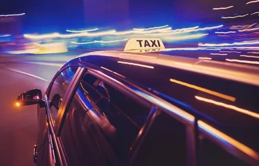 Foto op Plexiglas Taxi taking a left turn at night © corepics