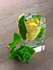 cocktail with lemon and peppermint leaves