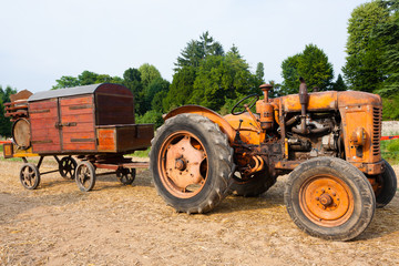 Old tractor with farm wagon, agriculture, rural life