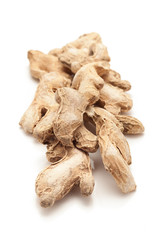 Row of Organic Dried Ginger root or Sonth (Zingiber officinale) isolated on white background.