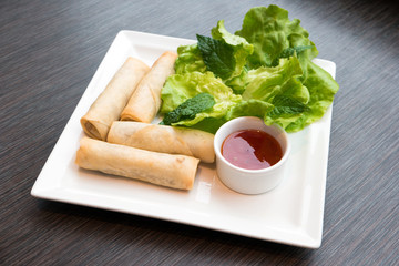 Spring rolls served with dipping sauce
