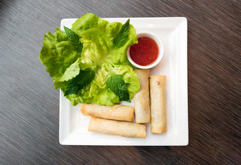 Spring rolls served with dipping sauce