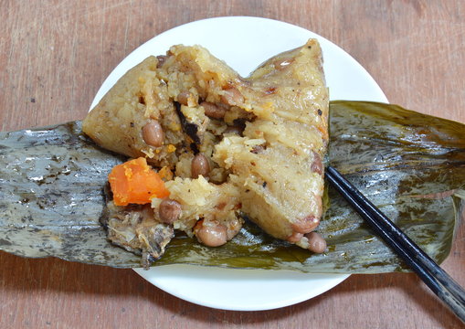 sticky rice steam with pork and salt egg in banana leaf of Chinese Duanwu festival