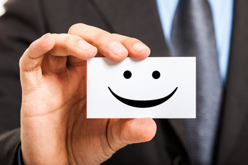Man holding a smiling business card