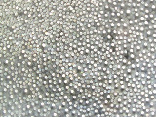 abstract white bokeh lights on grey background