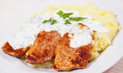 meat with mashed potatoes and sauce