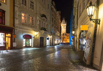 Fototapeta na wymiar Night view of old street and Astronomical Clock Orloj in Prague. Czech Republic