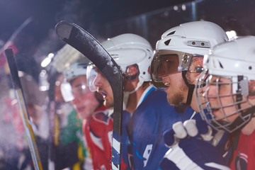 ice hockey players on bench