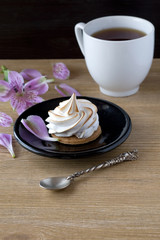 meringue cookies and a cup of tea