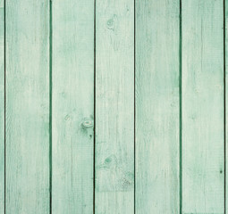 Old wooden board painted light green.