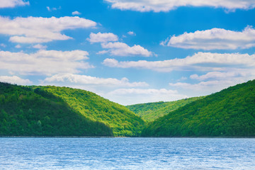 green hills on bank of river