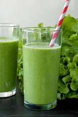 Healthy drink with ingredients on wooden background