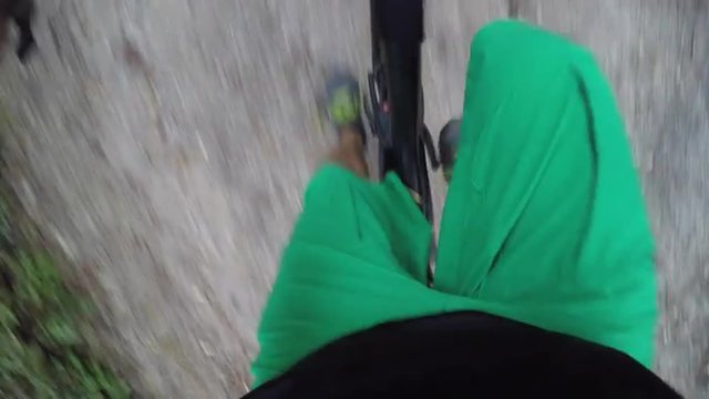 MTB rider climbs uphill with freeride bike