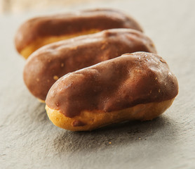 Cream Puffs, Profiteroles, close up on dark